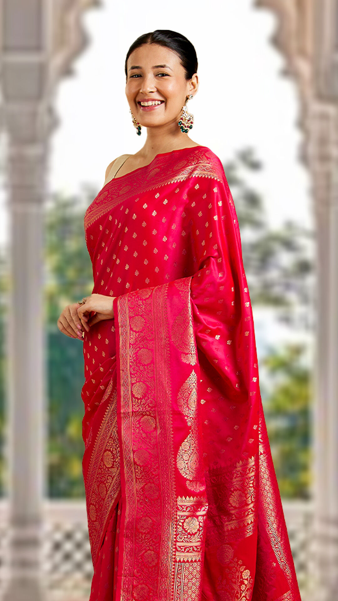 Woman in a beautiful red silk saree showcasing classic Indian elegance